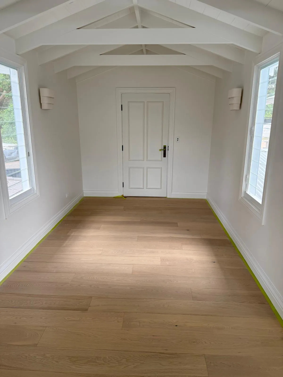 Exposed beam ceiling with oak flooring throughout